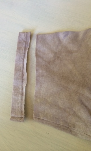 1. Start by cutting the edges of the sleeves off. 